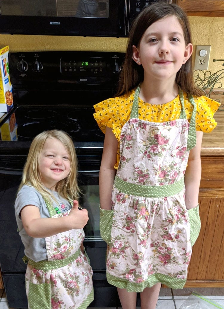 girls in aprons